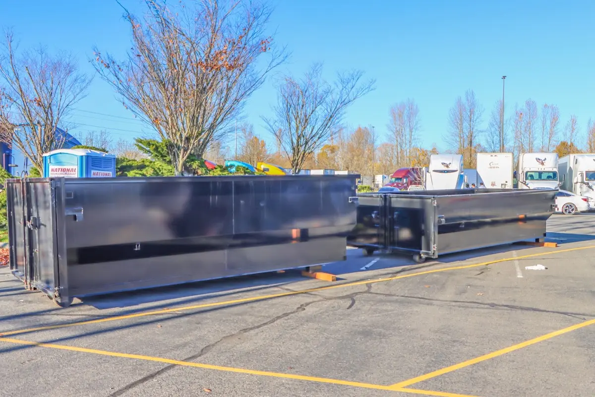 Professional dumpster rental service with roll-off container on residential driveway in Rock Hill